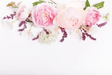 Festive flowers English rose composition on the white background. Overhead top view, flat lay. Copy space. Birthday, Mother's, Valentines, Women's, Wedding Day concept