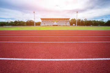 White lines of stadium and texture of running racetrack red rubber racetracks in outdoor stadium...