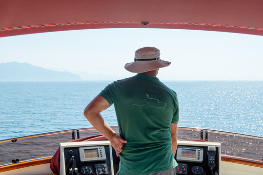 skipper driving a yacht on the sea