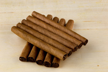 Small Cigars on a Wooden Table Top