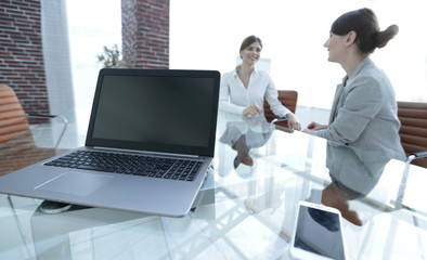 Fototapeta na wymiar laptop and a smartphone on the desktop of a businessman