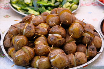 Potatoes with lard on skewers. Ukrainian national food.