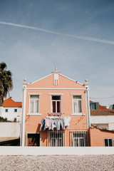 Authentic photography. Clothes dry on the facade of an apartment building in Lisbon in Portugal....