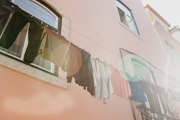 Authentic photography. Clothes dry on the facade of an apartment building in Lisbon in Portugal....