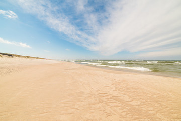 Fototapeta na wymiar View of the dunes in Nida, Lithuania. A popular destination in Europe in Lithuania. Beaches and huge dunes covering the end of the Curonian Spit are included in the UNESCO World Heritage Site