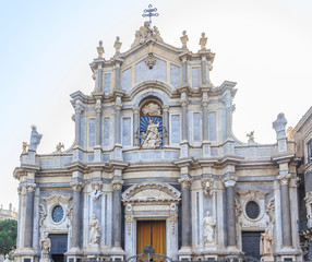 Fototapeta na wymiar Fragment of façade of Catania Cathedral (Italian: Duomo di Sant'Agata), dedicated to Saint Agatha.It is an example of Sicilian Baroque architecture. 