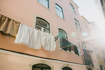 Authentic photography. Clothes dry on the facade of an apartment building in Lisbon in Portugal....