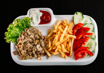 European international fusion cuisine, a beautiful dish on a white plate decorated with herbs and vegetables. a professional chef has prepared a delicious meal.