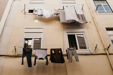 Authentic photography. Clothes dry on the facade of an apartment building in Lisbon in Portugal....