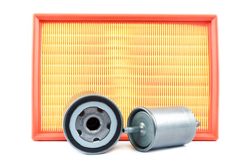 Automobile air, oil and fuel filter on white background