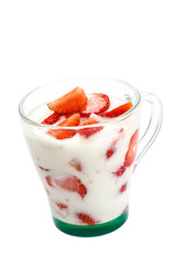 Fresh strawberry with sour cream in a bowl