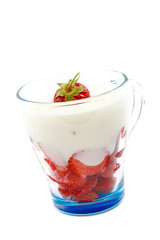 Fresh strawberry with sour cream in a bowl