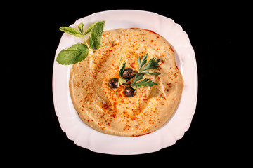 European international fusion cuisine, a beautiful dish on a white plate decorated with herbs and vegetables. a professional chef has prepared a delicious meal.