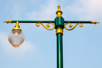 colorful old street lamp post . outdoor light element with beautiful sky background . electricity...