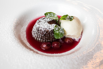 European international fusion cuisine, a beautiful dish on a white plate decorated with herbs and vegetables. a professional chef has prepared a delicious meal.