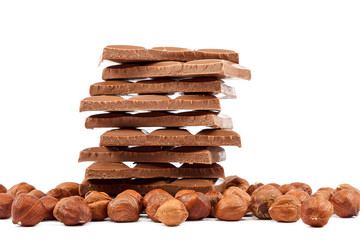 Chocolate tiles and nuts on white background