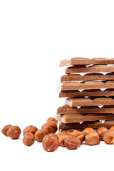 Chocolate tiles and nuts on white background