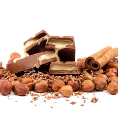 Chocolate tiles and nuts on white background