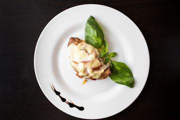 European international fusion cuisine, a beautiful dish on a white plate decorated with herbs and vegetables. a professional chef has prepared a delicious meal.