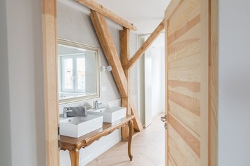 White wash basins in loft bathroom.