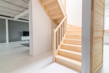 Pine stairs in hall.