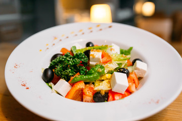 European international fusion cuisine, a beautiful dish on a white plate decorated with herbs and vegetables. a professional chef has prepared a delicious meal.