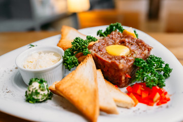 European international fusion cuisine, a beautiful dish on a white plate decorated with herbs and vegetables. a professional chef has prepared a delicious meal.