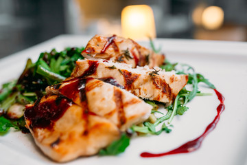 European international fusion cuisine, a beautiful dish on a white plate decorated with herbs and vegetables. a professional chef has prepared a delicious meal.