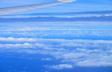 Naklejka na ściany i meble Beautiful blue sky and white cloud view from the plane