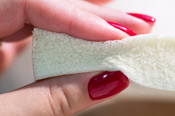 Nature para latex rubber, pillow and mattress material in the hands of a woman. The concept of...