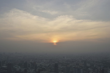 Aerial view of modern city tower at sunset, Bangkok Thailand
