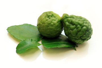 Bergamots (Kaffir lime) with leaf isolated in white background.