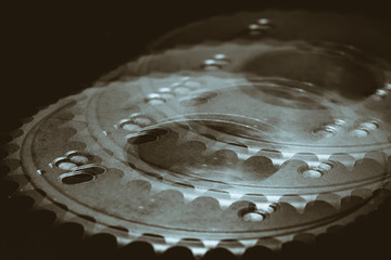 Monochrome multi exposition background of gear close up. Artwork from auto part in macro...