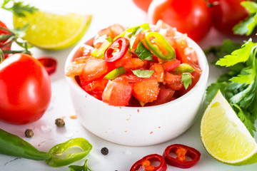 Traditional Latin American mexican salsa sauce on white.