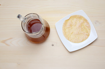 Fresh home made Kombucha fermented tea on a wooden background