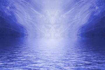 Naklejka premium Blue ink forming patterns resembling Rorschach Test ink blots reflected in water.