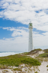 Fototapeta na wymiar Lighthouse on the rugged Atlantic Coast of Cape Town