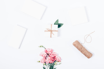 Feminine festive flat layout with pink bouquet