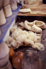 Crafts Wool slippers handmade production hands close up