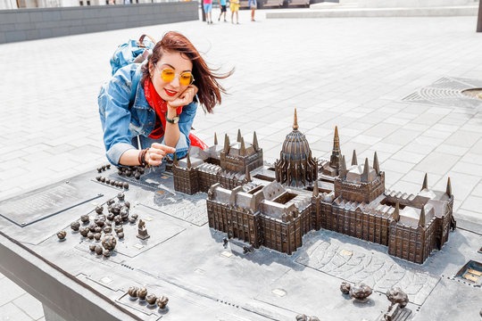 Traveler woman looking at Miniature model of Hungarian Parliament in mini park in Budapest