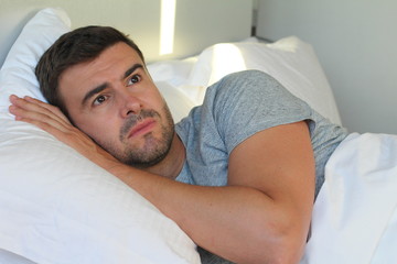 Sleepless handsome man feeling sorrow 