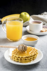 Healthy Breakfast coffee juice Cookies honey Banana on grey concrete background