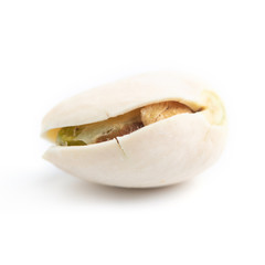few ripe roasted pistachios isolated on white background