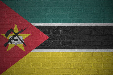 Flag of Mozambique on brick wall background, 3d illustration