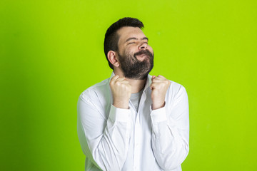 Portrait Of Happy Young Man Showing Thumb Up and victory sign
