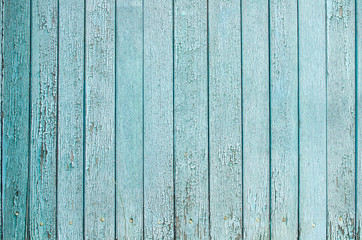 Fototapeta na wymiar Wooden old painted blue boards vertically background