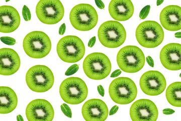 Creative layout made of Kiwi fruits snd mint leaves. Many slices of ripe and juicy Kiwifruit. Flat...