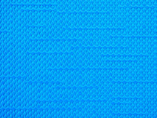 Fototapeta premium Close-up of the blue bubbly wavy plastic surface texture for background and wallpaper. High-quality macro photography.