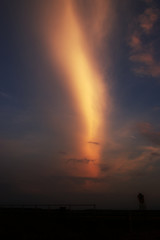 A beautiful and epic view of a blue, orange, pink, purple evening sky of shining clouds wallpaper background