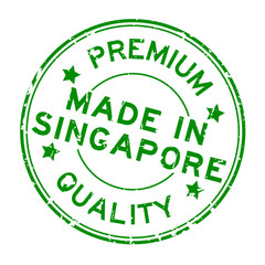 Grunge green premium quality made in Singapore round rubber business seal stamp on white background